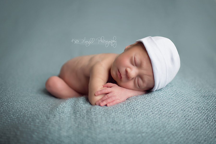 baby boy sleeping white hat